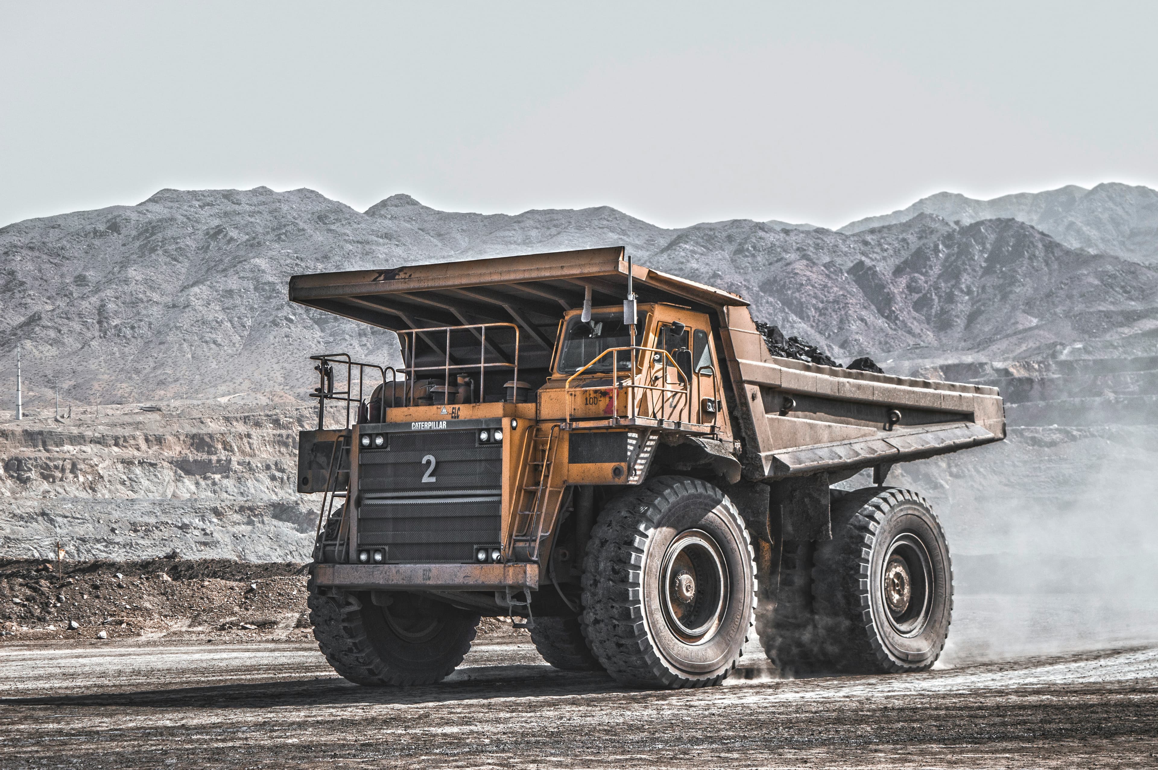 A loaded haul truck on a mine haul road.